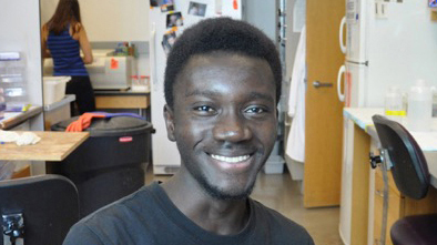 Person smiling in office setting.