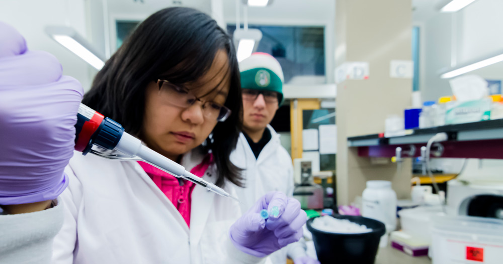 Students pipetting in lab