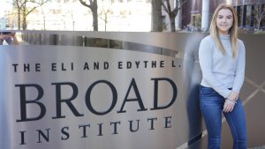 Person standing next to Broad Institute sign