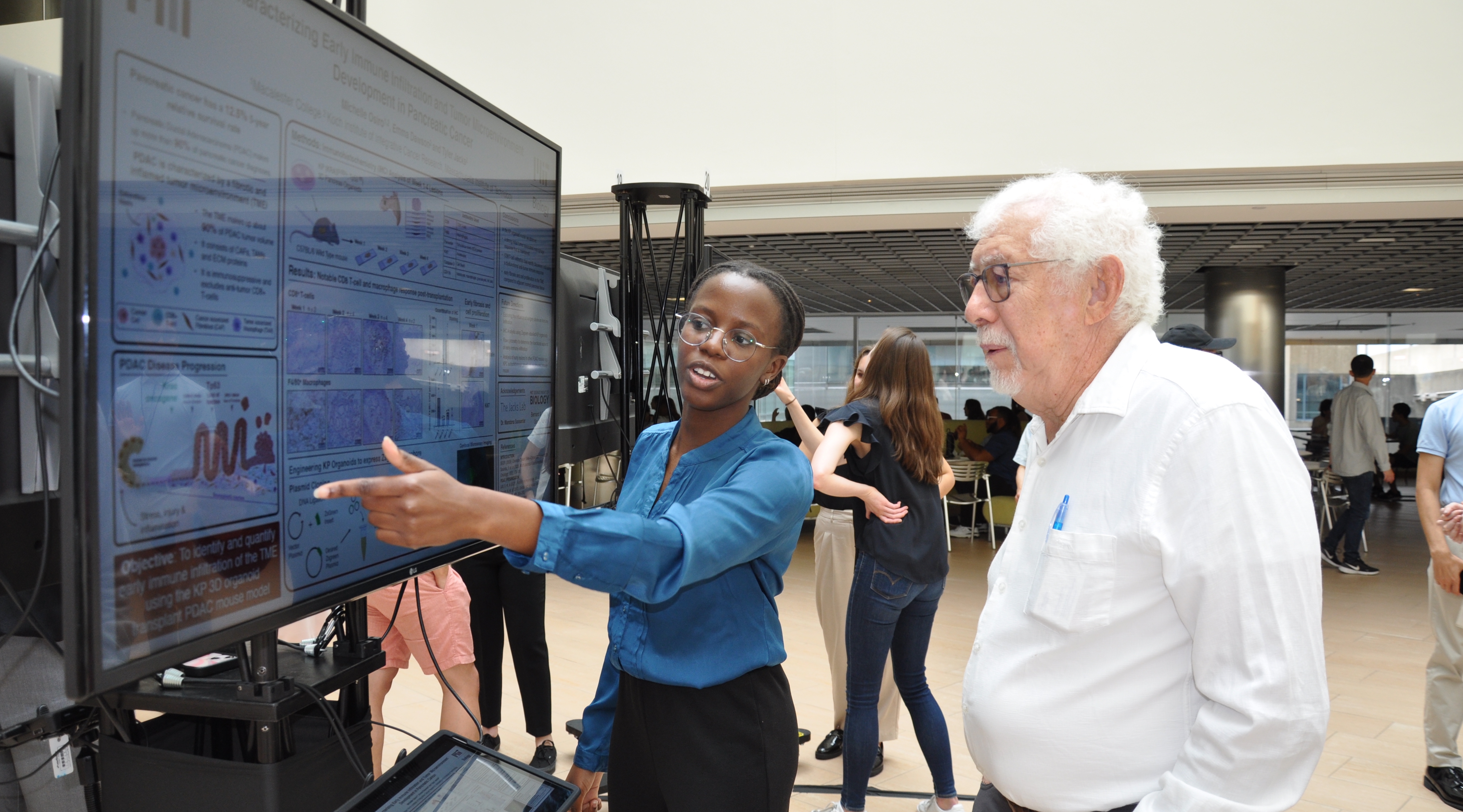 Student presenting a research poster